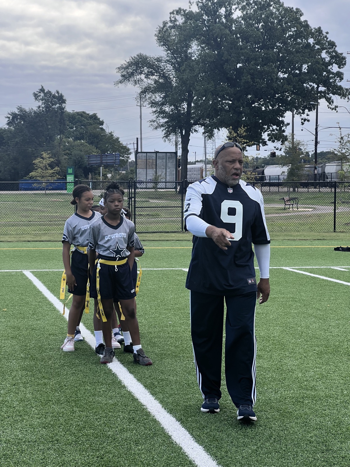 Camp Chambers NFL Flag Football coach and players on the field